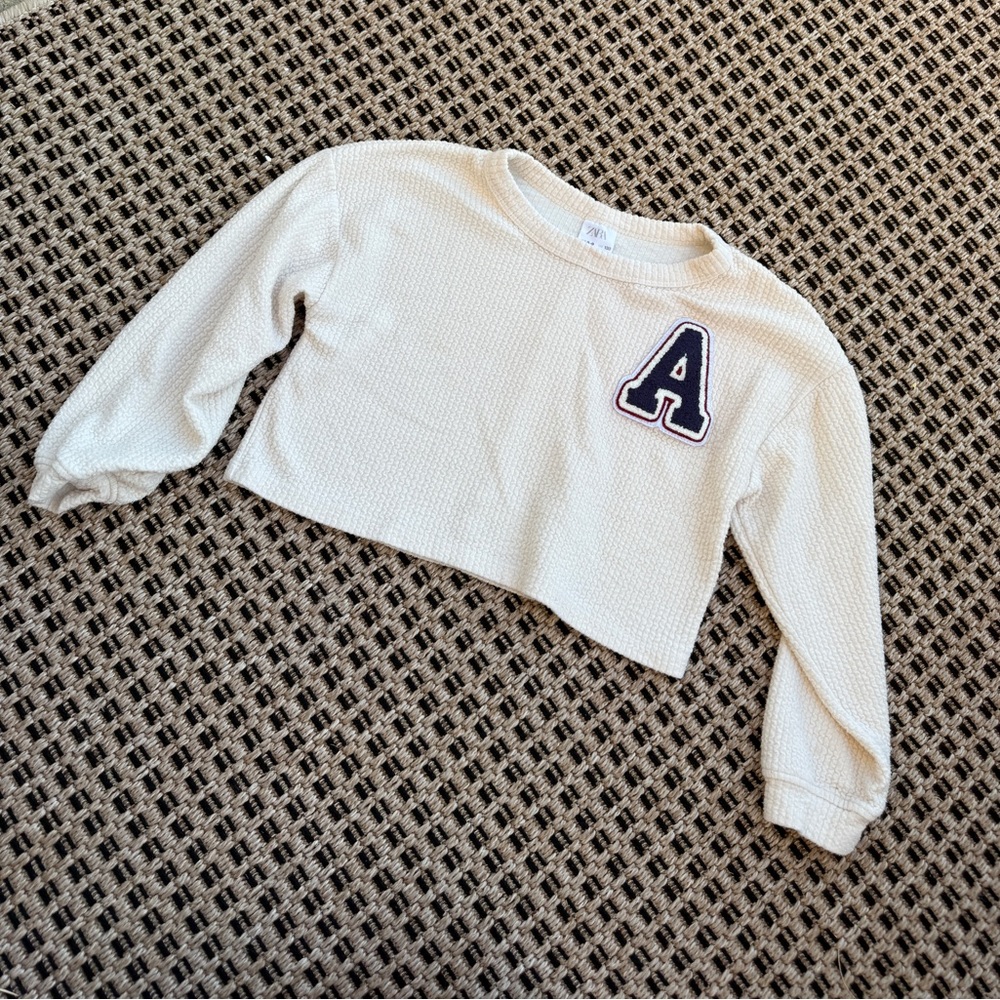 Cropped Zara long sleeve shirt, cream color with large collegiate A letter patch